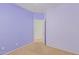 Spacious bedroom with light purple walls and carpeted floor at 29759 N Desert Angel Dr, San Tan Valley, AZ 85143