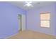 Lavender colored bedroom with closet and window at 29759 N Desert Angel Dr, San Tan Valley, AZ 85143