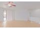 Spacious living room featuring tile floors and a sliding glass door at 29759 N Desert Angel Dr, San Tan Valley, AZ 85143