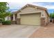 House exterior featuring a two-car garage and stone accents at 29759 N Desert Angel Dr, San Tan Valley, AZ 85143