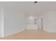 Open living room with access to bathroom and upper level at 29759 N Desert Angel Dr, San Tan Valley, AZ 85143