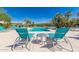 Stunning pool area with turquoise water, lounge chairs, and a table at 16013 S Desert Foothills Pkwy # 2005, Phoenix, AZ 85048