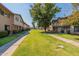 Neat row of townhouses with well-maintained landscaping and a grassy area at 6757 N 44Th Ave, Glendale, AZ 85301