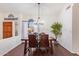 Bright dining room features a wood table with leather chairs and a chandelier at 8561 E Yucca Blossom Cir, Gold Canyon, AZ 85118