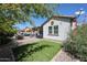 Landscaped backyard with patio, grass, and a view of the house at 41301 W Sussex Dr, Maricopa, AZ 85138