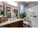 Clean bathroom with walk-in shower and grab bars at 41301 W Sussex Dr, Maricopa, AZ 85138