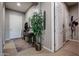 Hallway with coat closet and access to other rooms at 41301 W Sussex Dr, Maricopa, AZ 85138