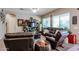 Relaxing living room featuring comfortable seating and a large TV at 41301 W Sussex Dr, Maricopa, AZ 85138