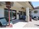 Covered patio with seating area, ceiling fan, and sliding glass door at 41301 W Sussex Dr, Maricopa, AZ 85138