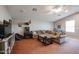Game room with sectional sofa, TV and arcade game at 41301 W Sussex Dr, Maricopa, AZ 85138