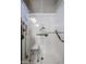 Walk-in shower with grab bars and bench seat at 41301 W Sussex Dr, Maricopa, AZ 85138