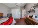 Bedroom with double bed, closet, and built-in shelving at 41301 W Sussex Dr, Maricopa, AZ 85138