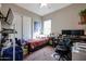 Bedroom with a twin bed, workspace, and closet at 41301 W Sussex Dr, Maricopa, AZ 85138