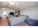 Spacious loft with sectional sofa and views to hallway at 41301 W Sussex Dr, Maricopa, AZ 85138