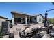Large backyard with covered patio, fire pit and seating area at 41301 W Sussex Dr, Maricopa, AZ 85138