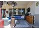 Covered patio with seating area, ceiling fan, and multiple heaters at 41301 W Sussex Dr, Maricopa, AZ 85138