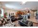 Spacious living room with leather furniture and a large TV at 41301 W Sussex Dr, Maricopa, AZ 85138