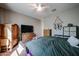 Bright bedroom with a queen bed and built-in wardrobe at 41301 W Sussex Dr, Maricopa, AZ 85138