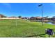 Community green space with pond and BBQ grills at 40968 W Crane Dr, Maricopa, AZ 85138