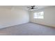 Bright bedroom with ceiling fan and carpet at 7329 N Via Camello Del Norte -- # 117, Scottsdale, AZ 85258