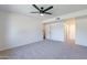 Well-lit bedroom featuring carpet and access to hallway at 7329 N Via Camello Del Norte -- # 117, Scottsdale, AZ 85258