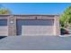 Attached garage with light-colored stucco exterior at 7329 N Via Camello Del Norte -- # 117, Scottsdale, AZ 85258