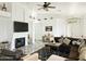 Living room with fireplace, tiled floors, and ample natural light at 18812 N 90Th Pl, Scottsdale, AZ 85255