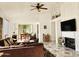 Bright living room featuring a fireplace and tiled floors at 18812 N 90Th Pl, Scottsdale, AZ 85255