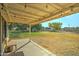 Covered patio with string lights and views of the backyard at 18827 E Via Del Jardin --, Queen Creek, AZ 85142