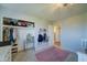 Bedroom with a vanity, closet, and pink rug at 18827 E Via Del Jardin --, Queen Creek, AZ 85142