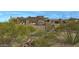 Contemporary home nestled in the desert landscape with a pool and patio at 39494 N 105Th St # 74, Scottsdale, AZ 85262