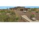 Contemporary home with a large driveway and desert landscaping at 39494 N 105Th St # 74, Scottsdale, AZ 85262