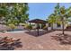 Spacious backyard oasis with a pergola and outdoor kitchen at 4142 E Zion Pl, Chandler, AZ 85249
