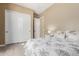 Bedroom with a double bed, white closet doors and light flooring at 4142 E Zion Pl, Chandler, AZ 85249