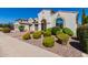 Two-story house with arched entryway, landscaped yard, and driveway at 4142 E Zion Pl, Chandler, AZ 85249