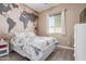 Bedroom featuring a world map accent wall and a double bed at 4142 E Zion Pl, Chandler, AZ 85249