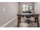 Home office with wooden desk, chair, and hardwood floors at 4142 E Zion Pl, Chandler, AZ 85249