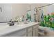 Clean bathroom with a shower/tub combo and cactus-themed decor at 4142 E Zion Pl, Chandler, AZ 85249