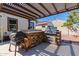 Outdoor kitchen with a built-in grill and pergola cover at 4142 E Zion Pl, Chandler, AZ 85249