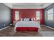 Main bedroom with wood floors and red and gray accent walls at 4142 E Zion Pl, Chandler, AZ 85249