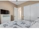 Bedroom with double bed, white dresser, and access to another room at 4142 E Zion Pl, Chandler, AZ 85249