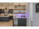 Stylish kitchen nook with floating shelves and neon sign at 1579 N Himosa Dr, Casa Grande, AZ 85122