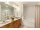 Bathroom with double vanity, bathtub, and shower at 5450 E Deer Valley Dr # 2206, Phoenix, AZ 85054