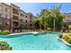 Community pool with surrounding lounge chairs at 5450 E Deer Valley Dr # 2206, Phoenix, AZ 85054