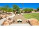 Community park with cornhole, playground, shaded seating, and walking paths at 28001 N 92Nd Ave, Peoria, AZ 85383