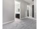 A bedroom with grey carpet and access to the bathroom at 28001 N 92Nd Ave, Peoria, AZ 85383