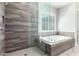 Bathroom with walk-in shower and soaking tub at 28001 N 92Nd Ave, Peoria, AZ 85383