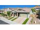 Single-story home with brick driveway and landscaped yard at 28001 N 92Nd Ave, Peoria, AZ 85383