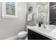 Clean bathroom with toilet, sink, and shower at 28001 N 92Nd Ave, Peoria, AZ 85383