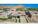 Single-story home with brick driveway and landscaped yard at 28001 N 92Nd Ave, Peoria, AZ 85383